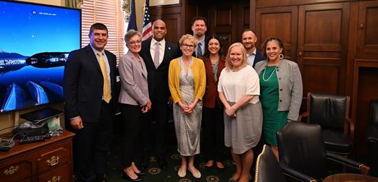 Rep. Houlahan, Rep. Bice, and Rep. Allred pose for a group photo with participants of a meeting